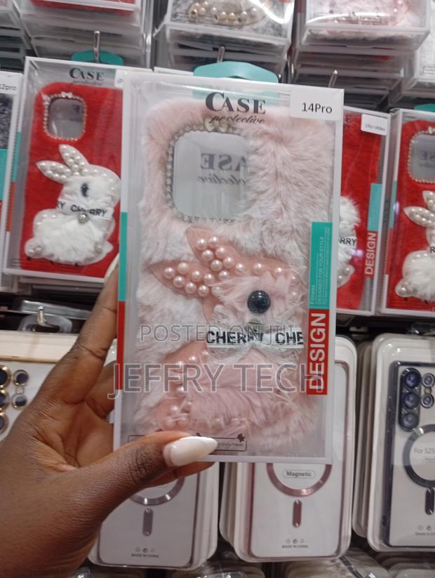 Fluffy Pink Faux Fur Phone Case Is to Fit the Apple iPhone 14 Pro.