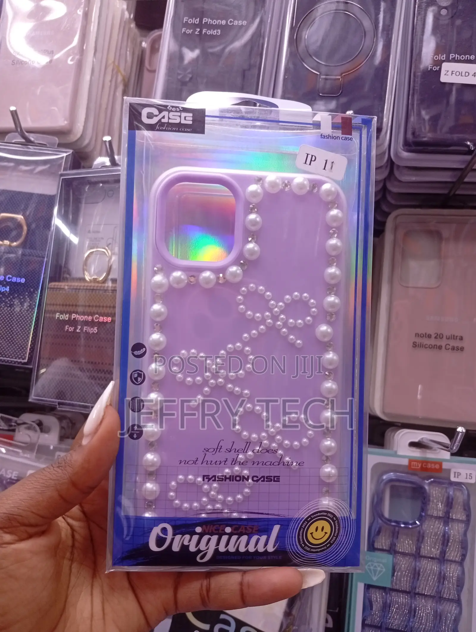 iPhone 11with a Decorative Design With Pearls and Bow Accents.