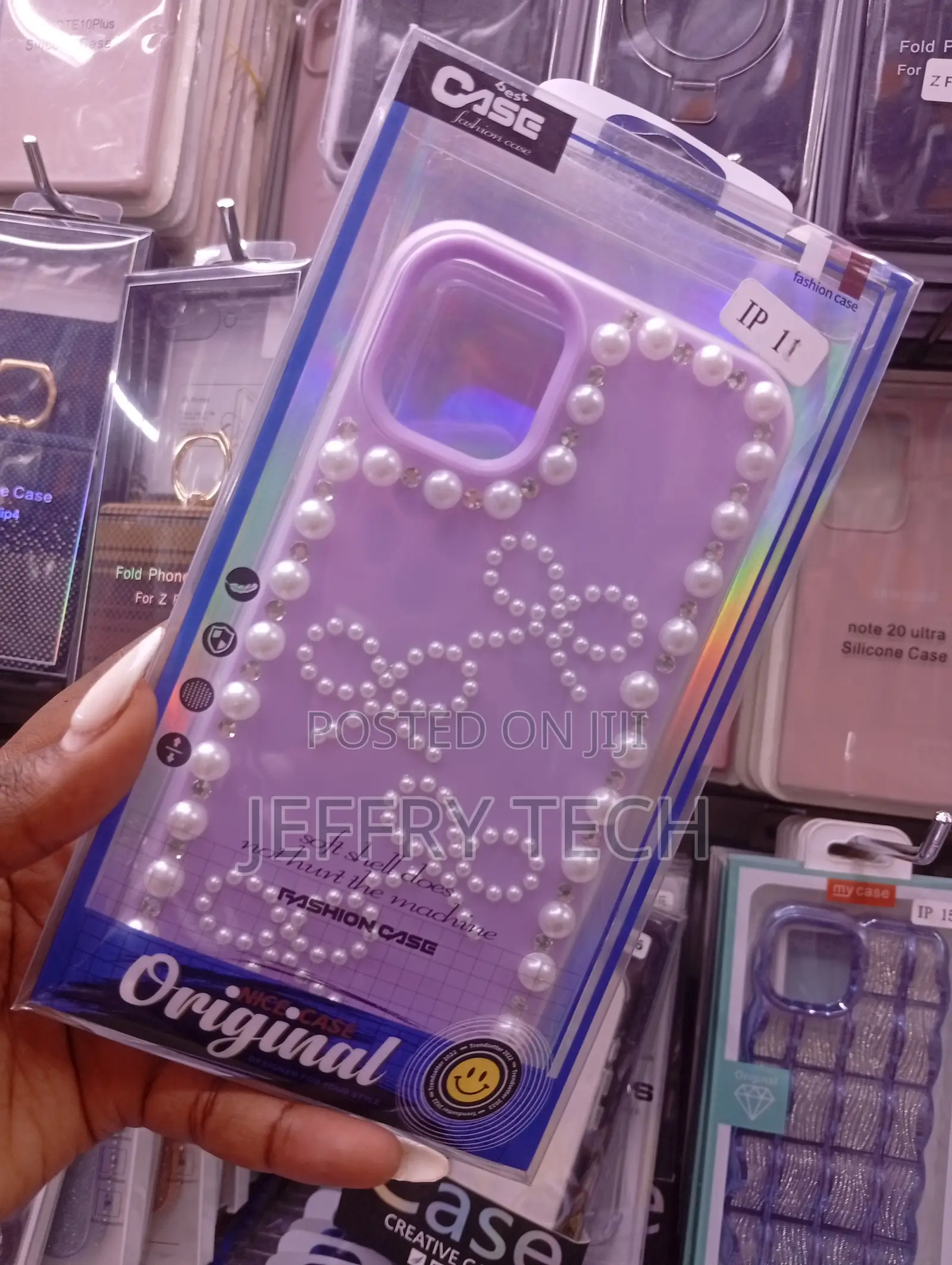 iPhone 11with a Decorative Design With Pearls and Bow Accents.