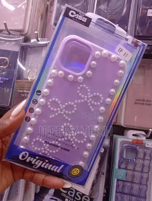iPhone 11with a Decorative Design With Pearls and Bow Accents.