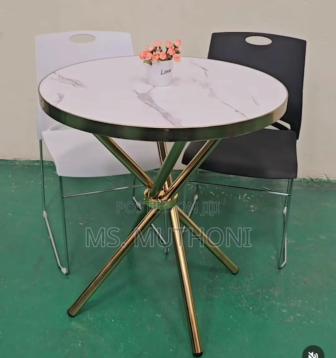 Conteprary Minimalist Dining Table Features a Marble-Effect Top
