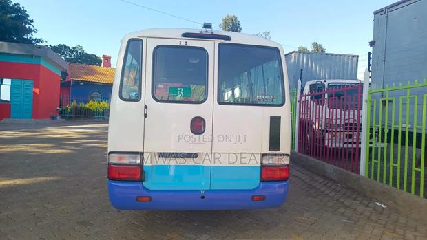 Toyota Coaster 2016 White - thumbnail 4