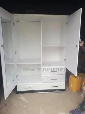 White Wall Dropped With Three Drawers