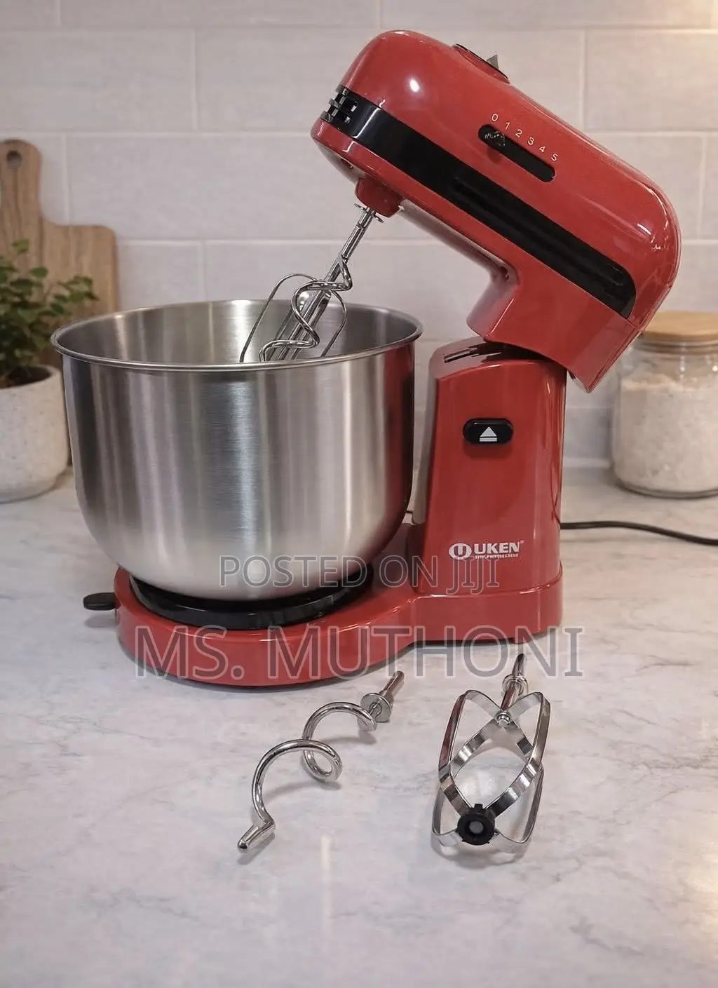 Uken Electric Hand Mixer With a Stainless Steel Bowl.
