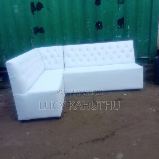 White Couch With Polished Wood Legs