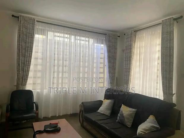 Radiant Curtains and White Sheers for a Refined Living Room Upgrade