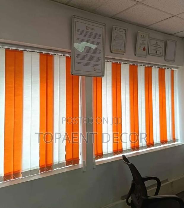 Vertical Perfection With Orange and White Blinds