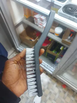 Handheld Wire Brush With a Plastic Handle