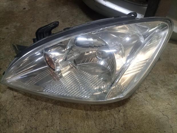 Headlight Mitsubishi Cedia 2004