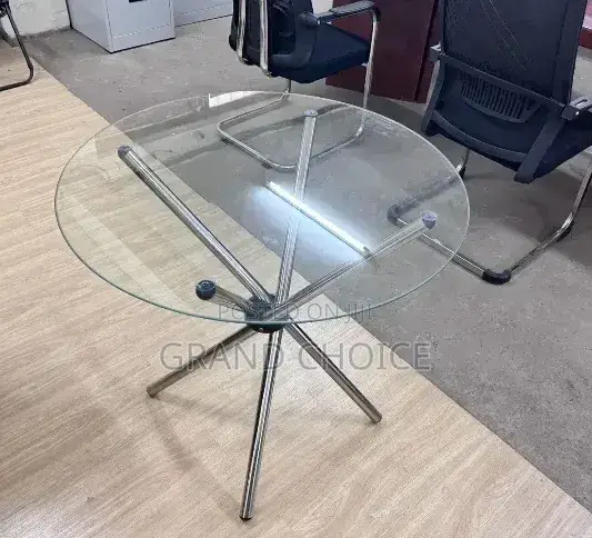 Modern Round Glass Coffee Table With A Metal Cross Base