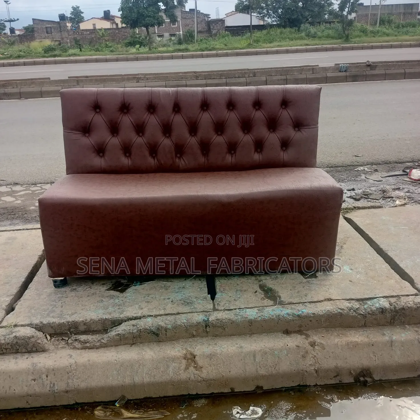 Brown Couch With Patterned Faux Leather.