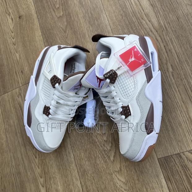 Nike Air Jordan 4 "Mocha" Sneakers.