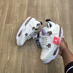 Nike Air Jordan 4 "Mocha" Sneakers.