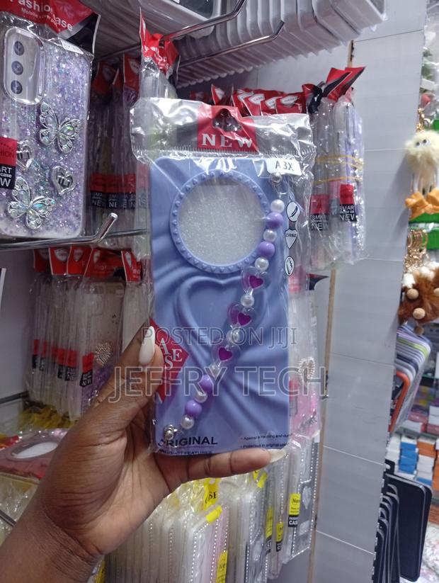 Oppo A3x Wavy Border and a Matching Beaded Heart Charm Strap Case