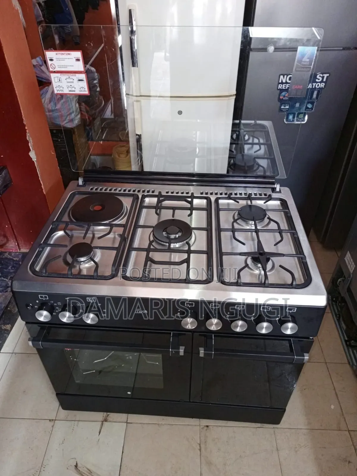 Mika 60 by 90cm Electric Cooker (1 Electric,4 Gases )