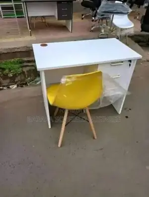Yellow Eames Office Chair and White Table