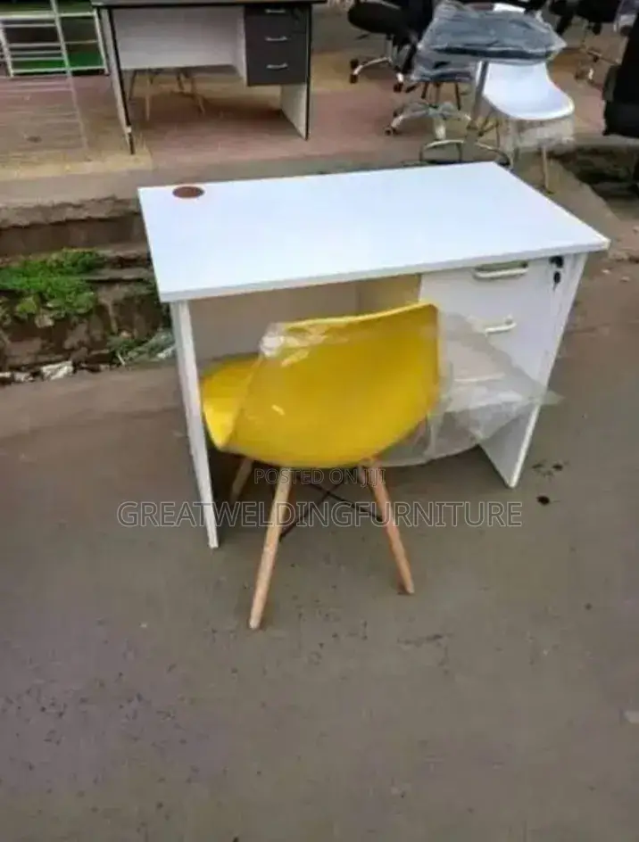 Yellow Eames Office Chair and White Table