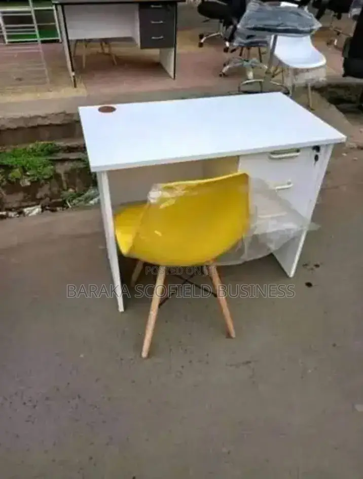 Yellow Eames Office Chair and White Table