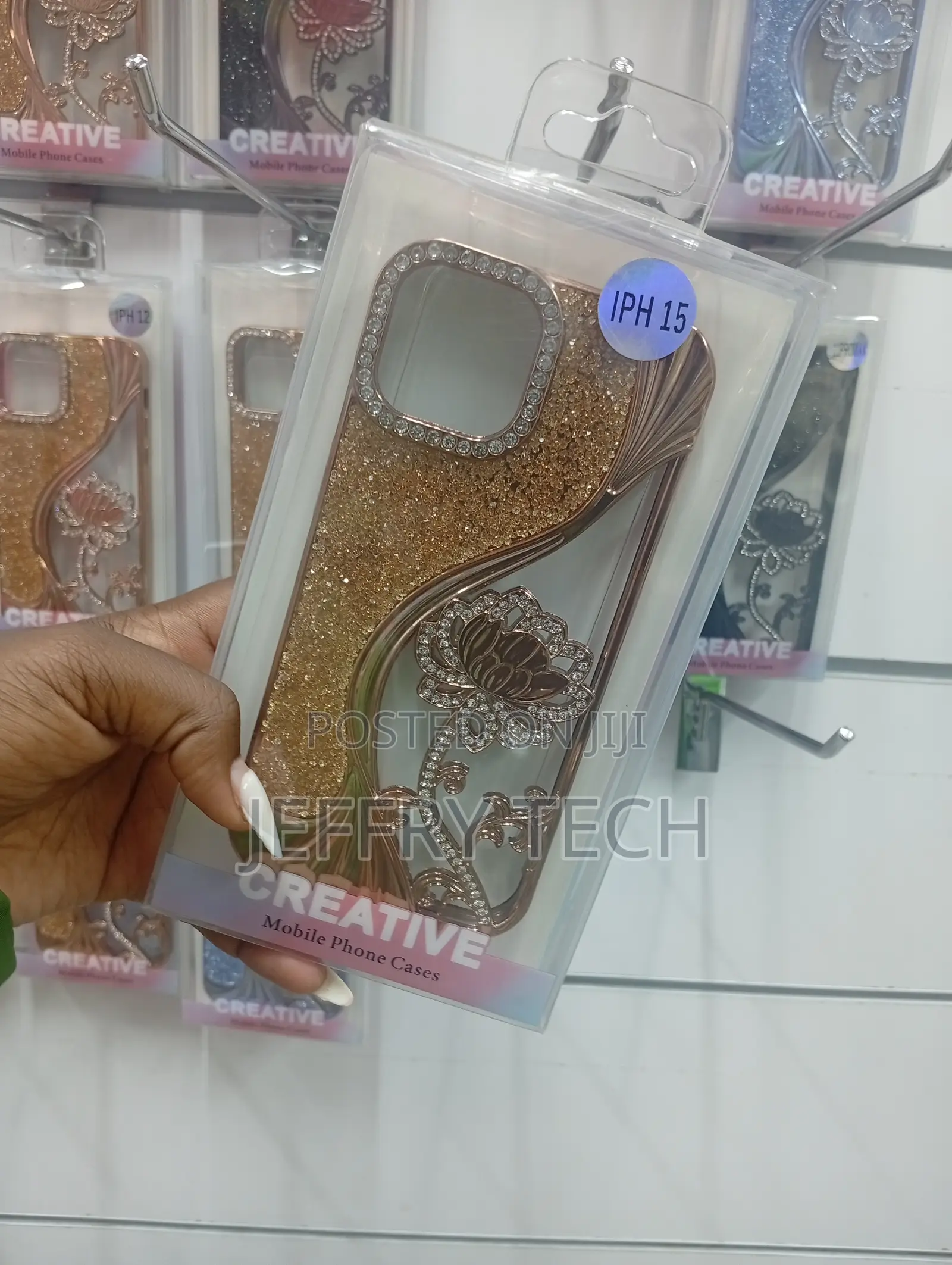 iPhone 15, Featuring Glitter, Crystals, and a Floral Design Case