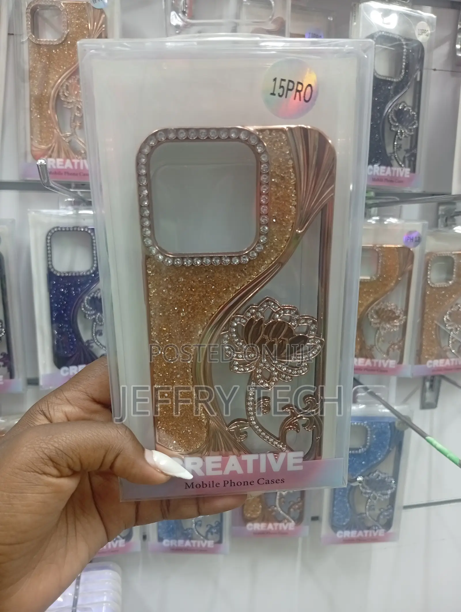 iPhone 15 Pro, Featuring Diamond-Like Studs and a Floral Pattern.