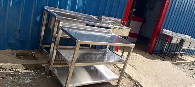 Stainless Steel Warking Top With Under Shelves.
