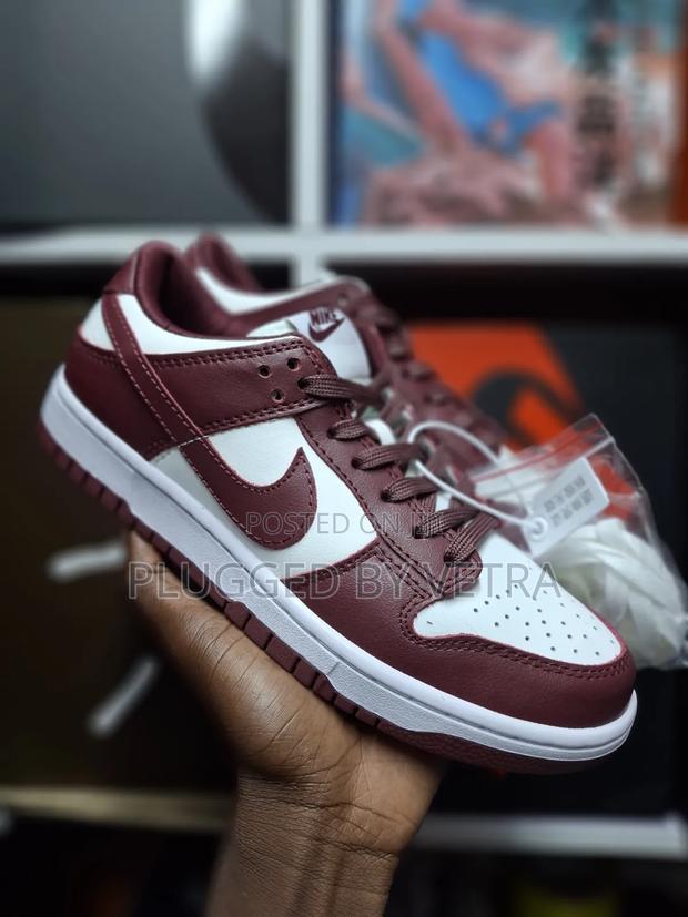 Nike Sb Dunks In*White and Dark Maroon Colourway*.
