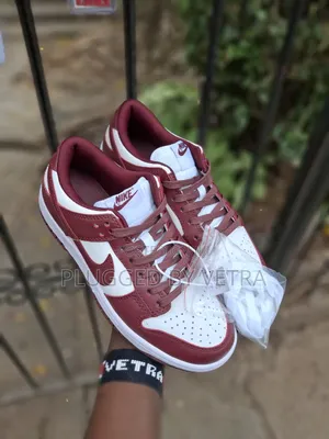 Nike Dunk Low in the 'Team Red' Colorway.