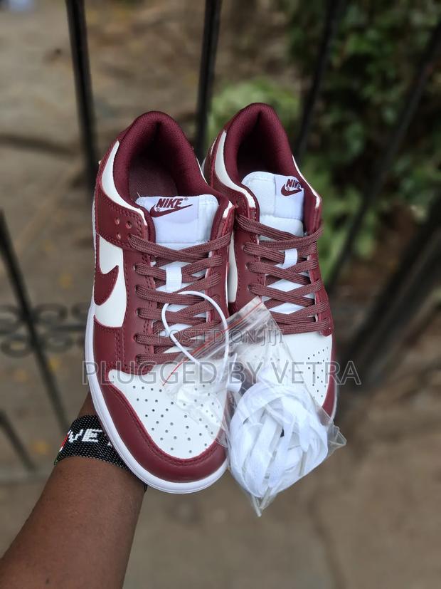 Nike Dunk Low in the 'Team Red' Colorway. - thumbnail 2