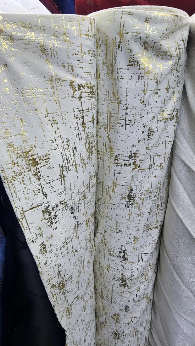 Offwhite Curtains With Gold Prints for Cosy Interiors