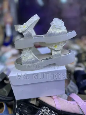 Glittery White Girl's Sandals Featuring a Floral Embellishment