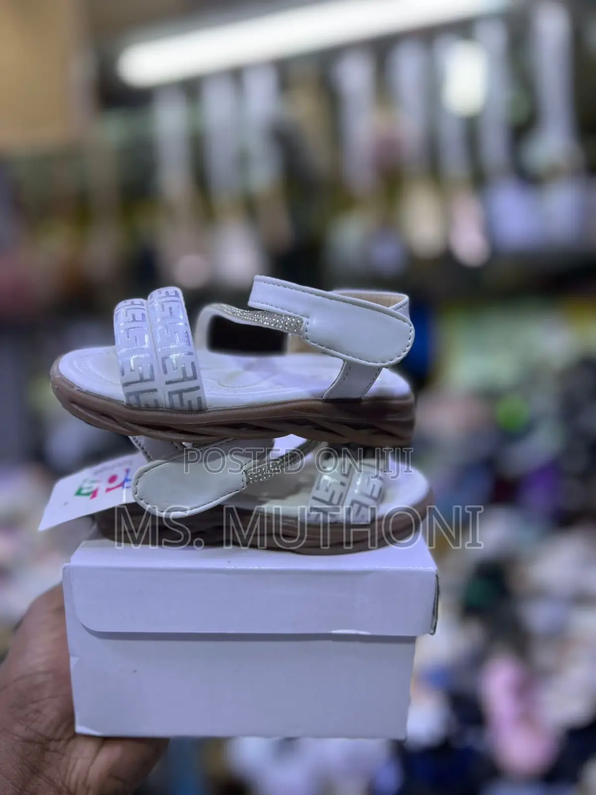 Glittery White Girl's Sandals Featuring a Floral Embellishment