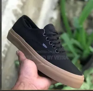 Vans Off the Wall in "Black Brown Sole Colourway"