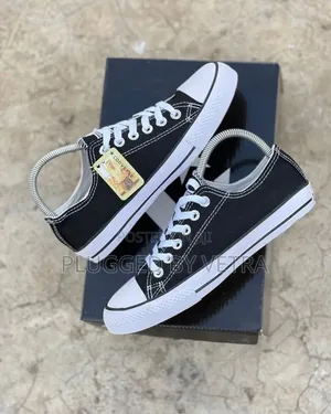 Classic Black And White Converse All Star Sneakers.