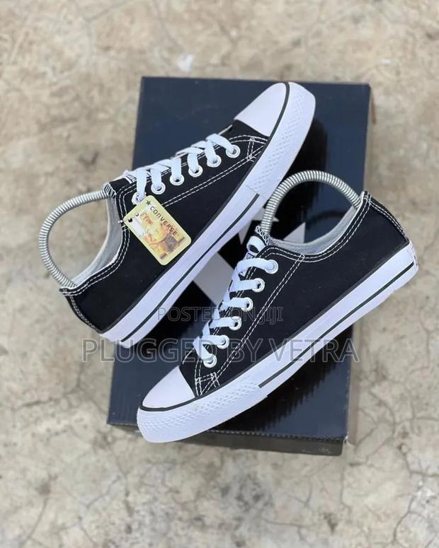 Classic Black And White Converse All Star Sneakers.