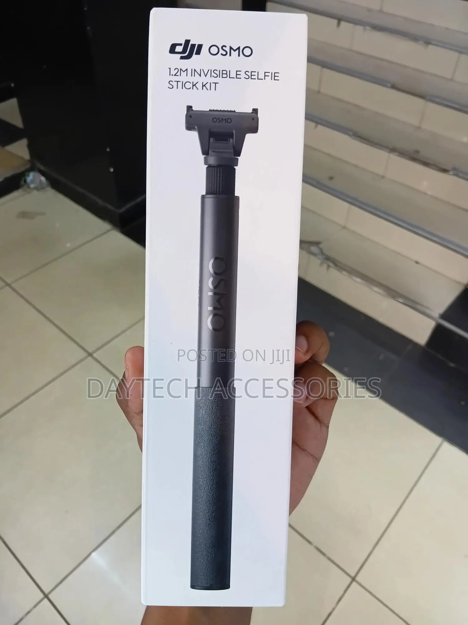 This Is a Dji Osmo 1.2m Invisible Selfie Stick Kit in Black.