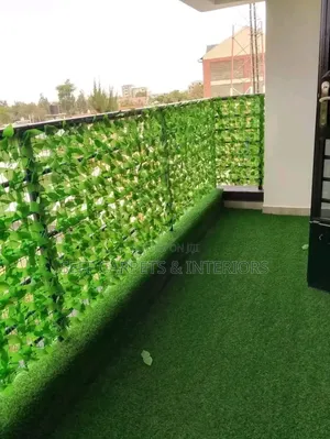 Green Flowered Balcony Fence and Grass Carpets