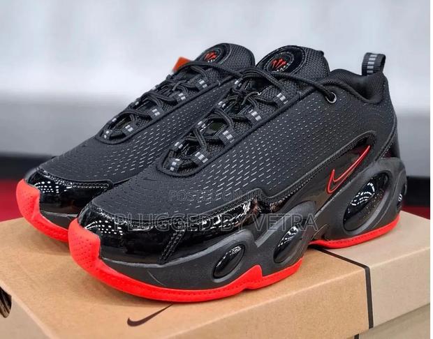Nocta Glide Sneakers in "Black and Red Colourway Models".