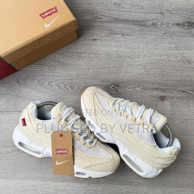 The Nike Air Max 95 Og "Levis - Light Orewood Brown" Denim Sneakers.