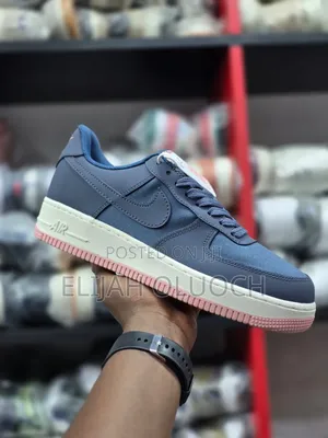 Nike Air Force 1 Low Sneakers in an Ashen Slate and Stardust Colorway.