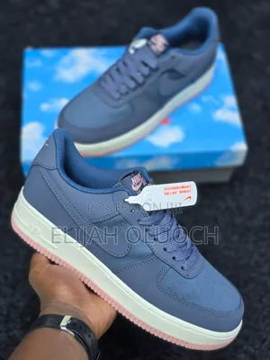 Nike Air Force 1 Low Sneakers in an Ashen Slate and Stardust Colorway.
