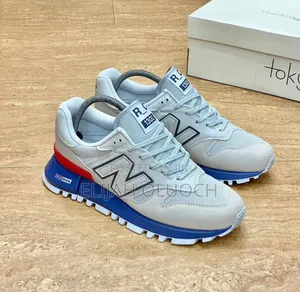 New Balance Rc1300 in a Grey, Blue, and Red