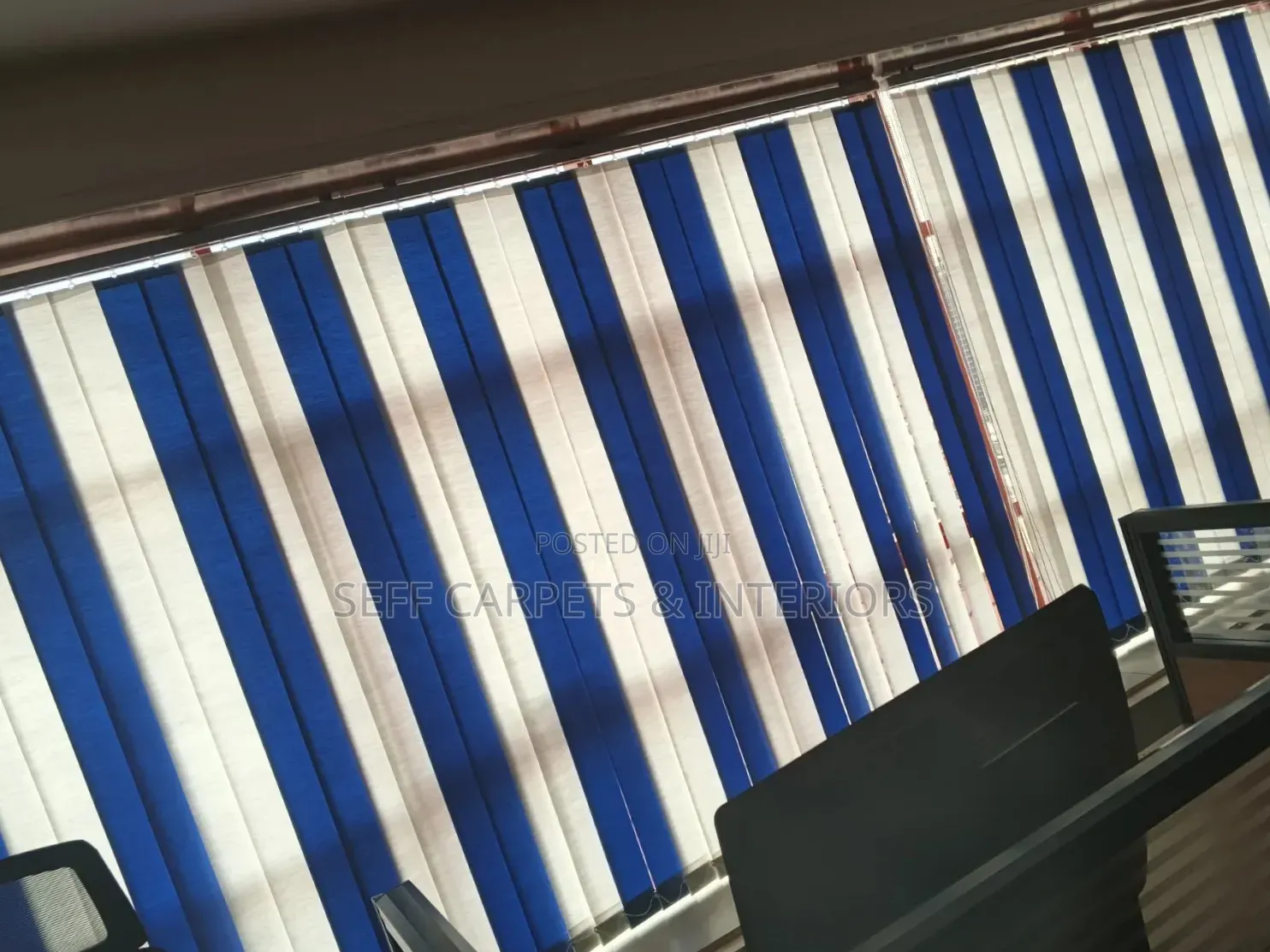Blue Fabric and White Fabric Vertical Blinds.