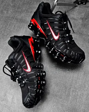 Shox Tl in a Black, Metallic Silver, and University Red Colorway.