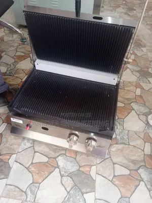 Commercial Gas-Powered Panini Press Grill Often Used for Cooking