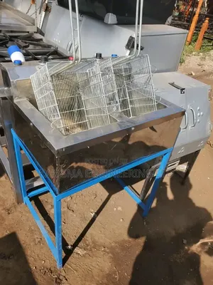 Stainless Steel Double Commercial Deep Fryer With a Blue Stand.
