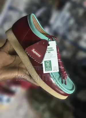 Supreme X Clarks Wallabee Patent Leather Shoes.