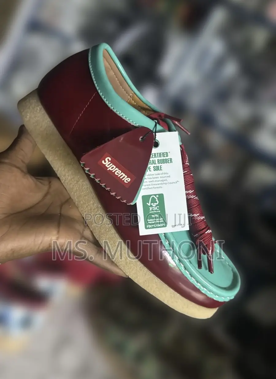 Supreme X Clarks Wallabee Patent Leather Shoes.