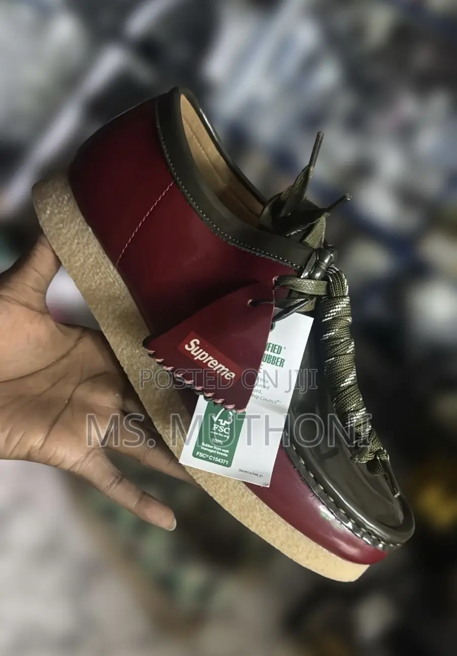Supreme X Clarks Wallabee Patent Leather Shoes.