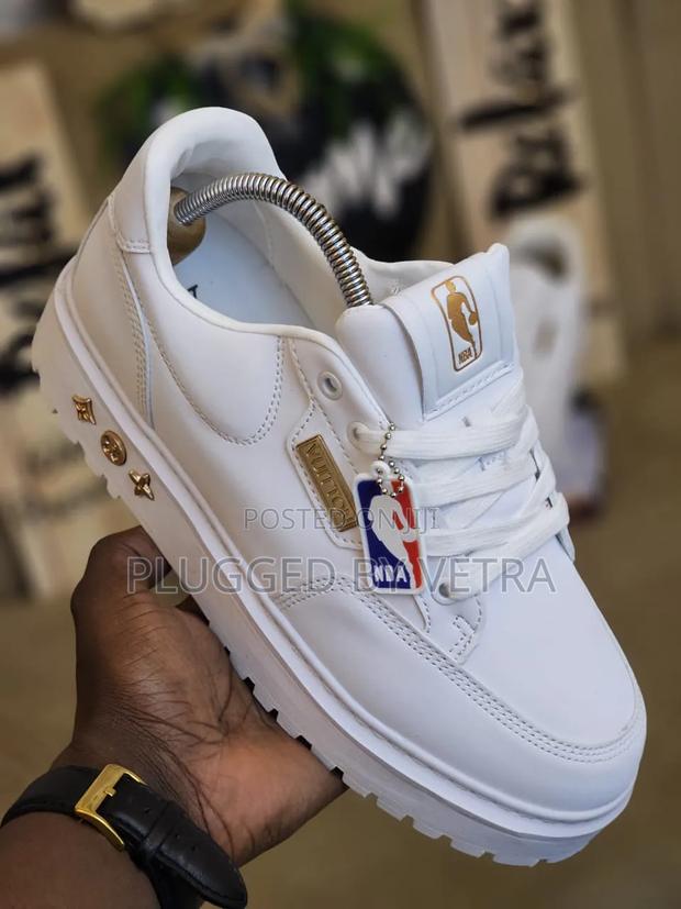 Louis Vuitton 'Nba Lakers' Sneakers in White With Gold Accents.
