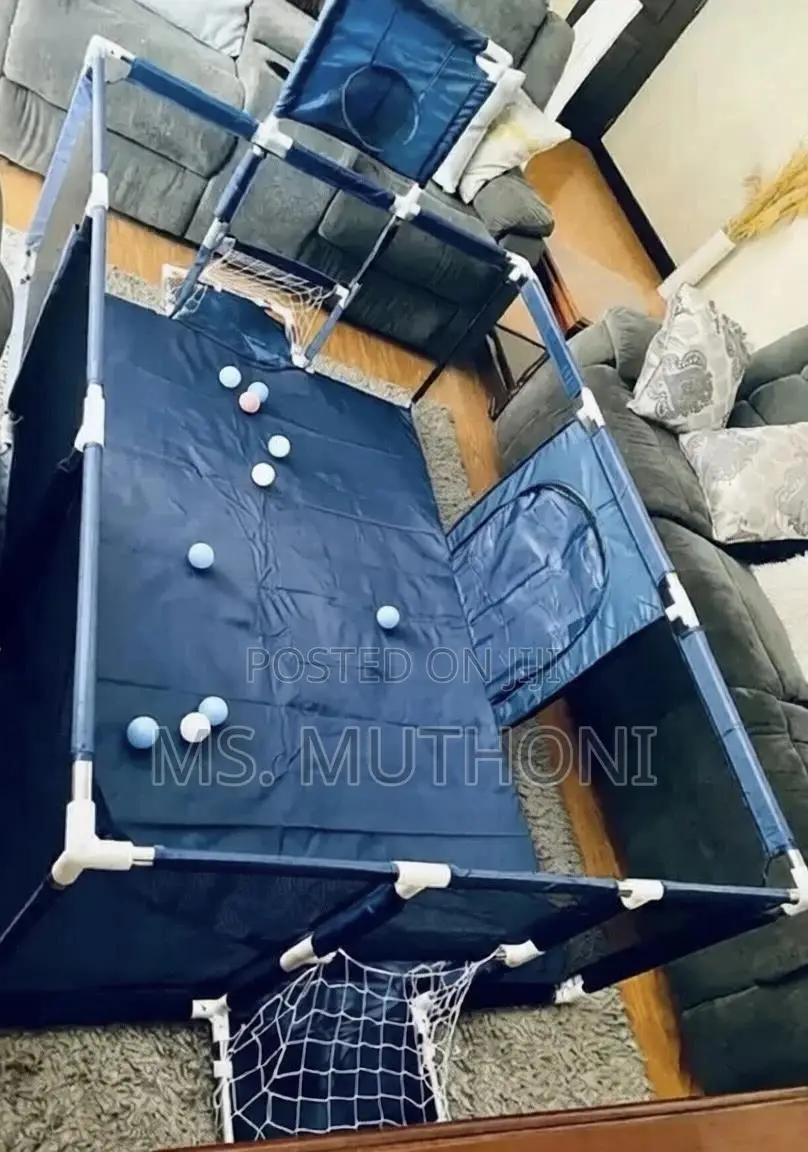 Baby Playpen With A Basketball Hoop And A Soccer Goal Net